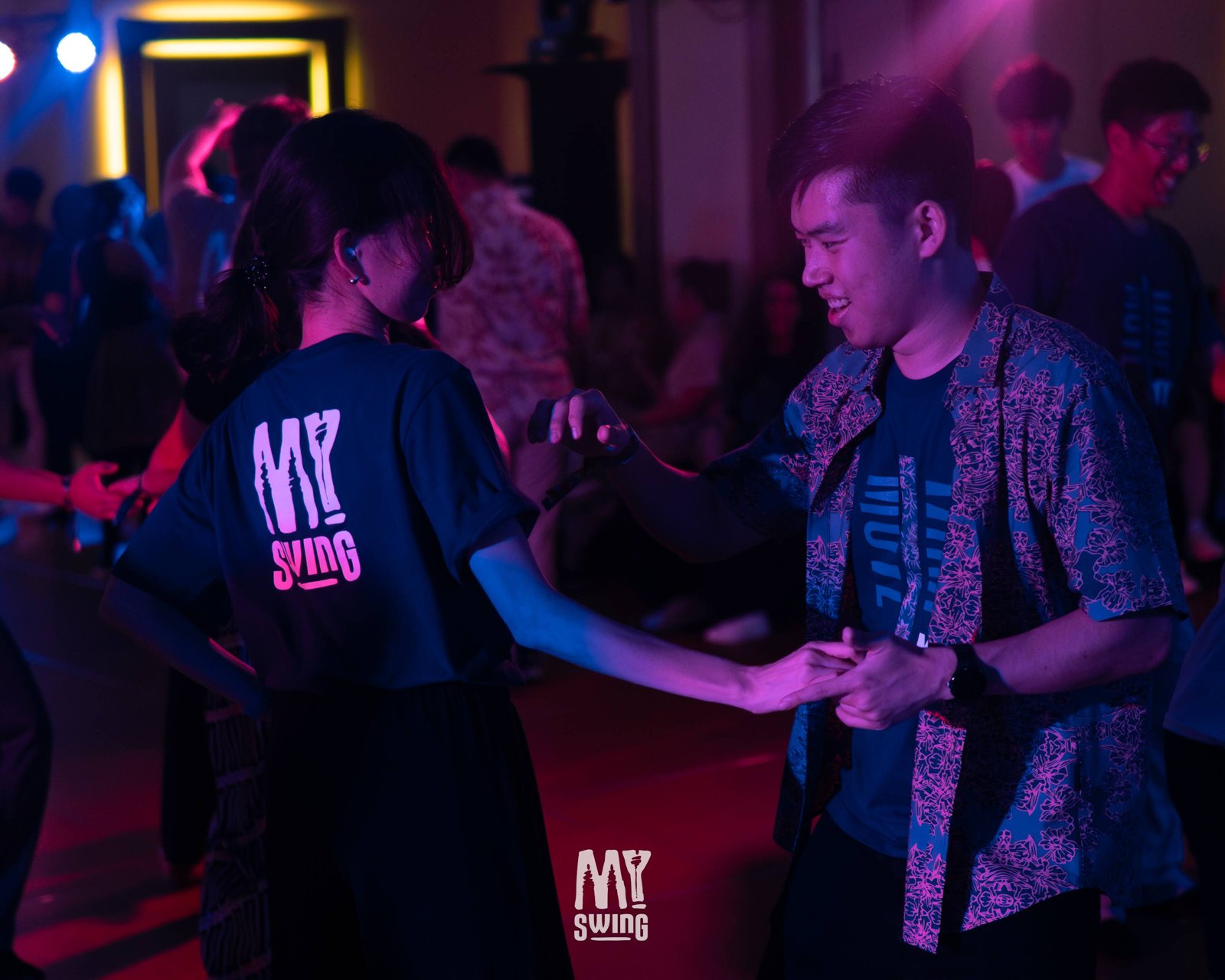 A smiling dancer connects with her partner at MY Swing 2025