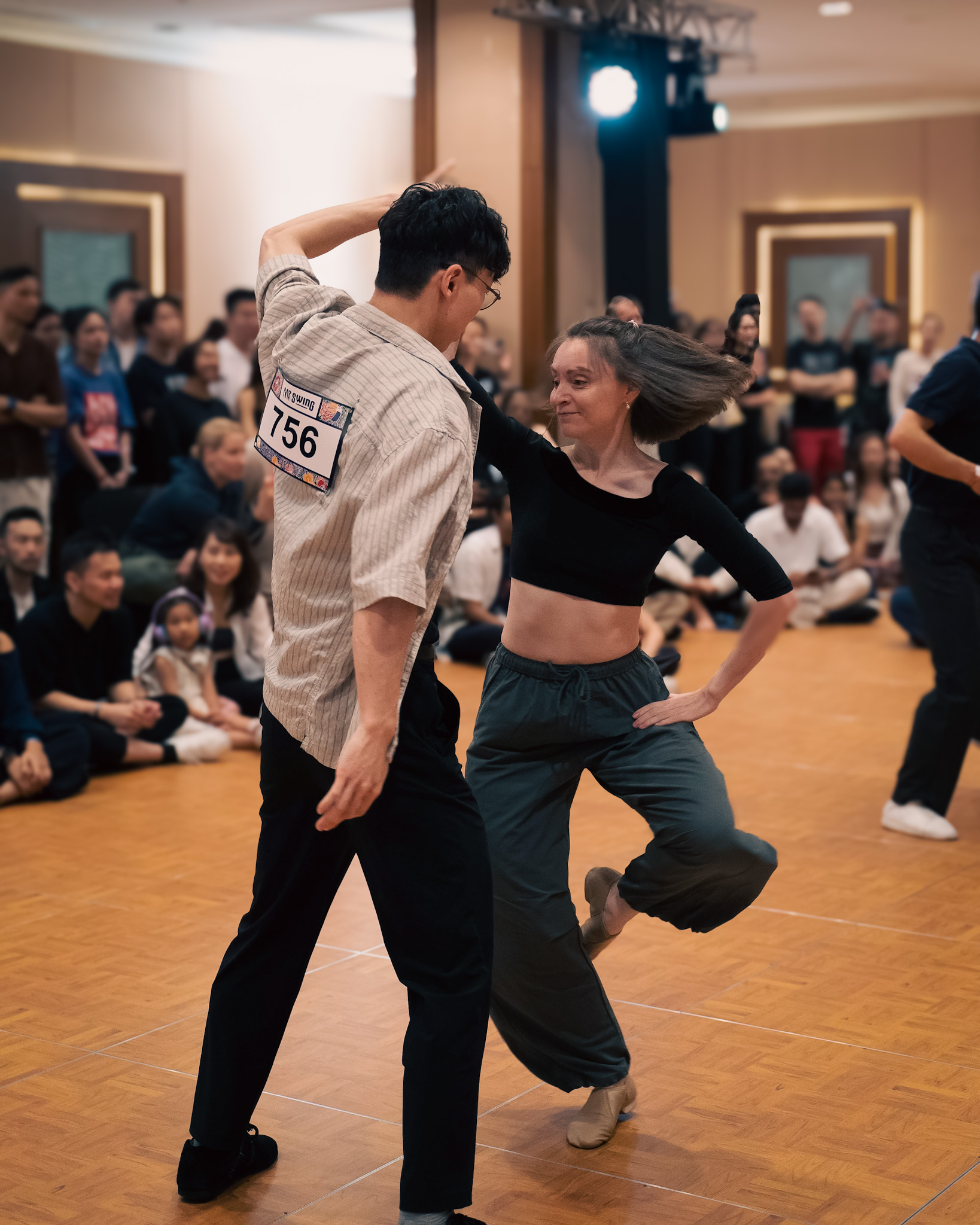 A couple steps together in a dynamic competition moment.