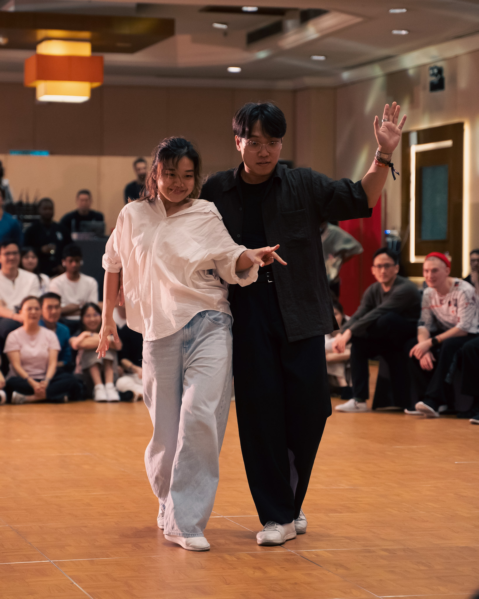 A couple moves side by side in a competition round.