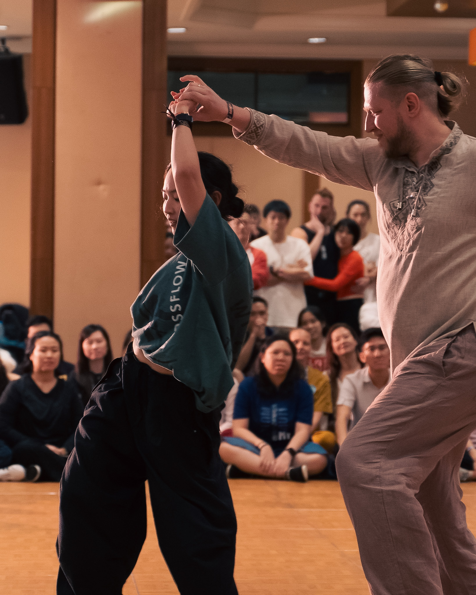 A couple turns together during a lively competition dance.