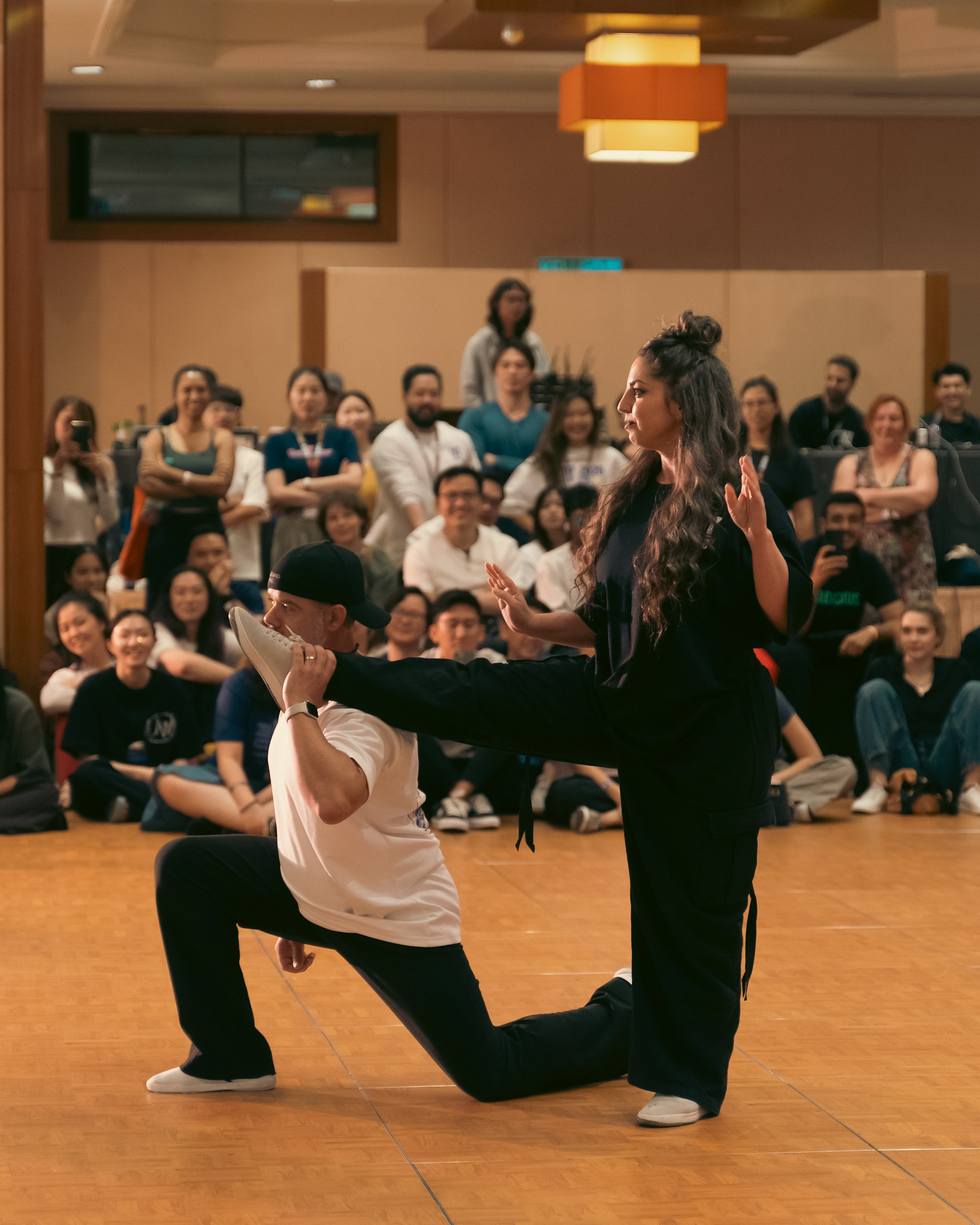 Partners perform a playful pose during the Pro Invitational.