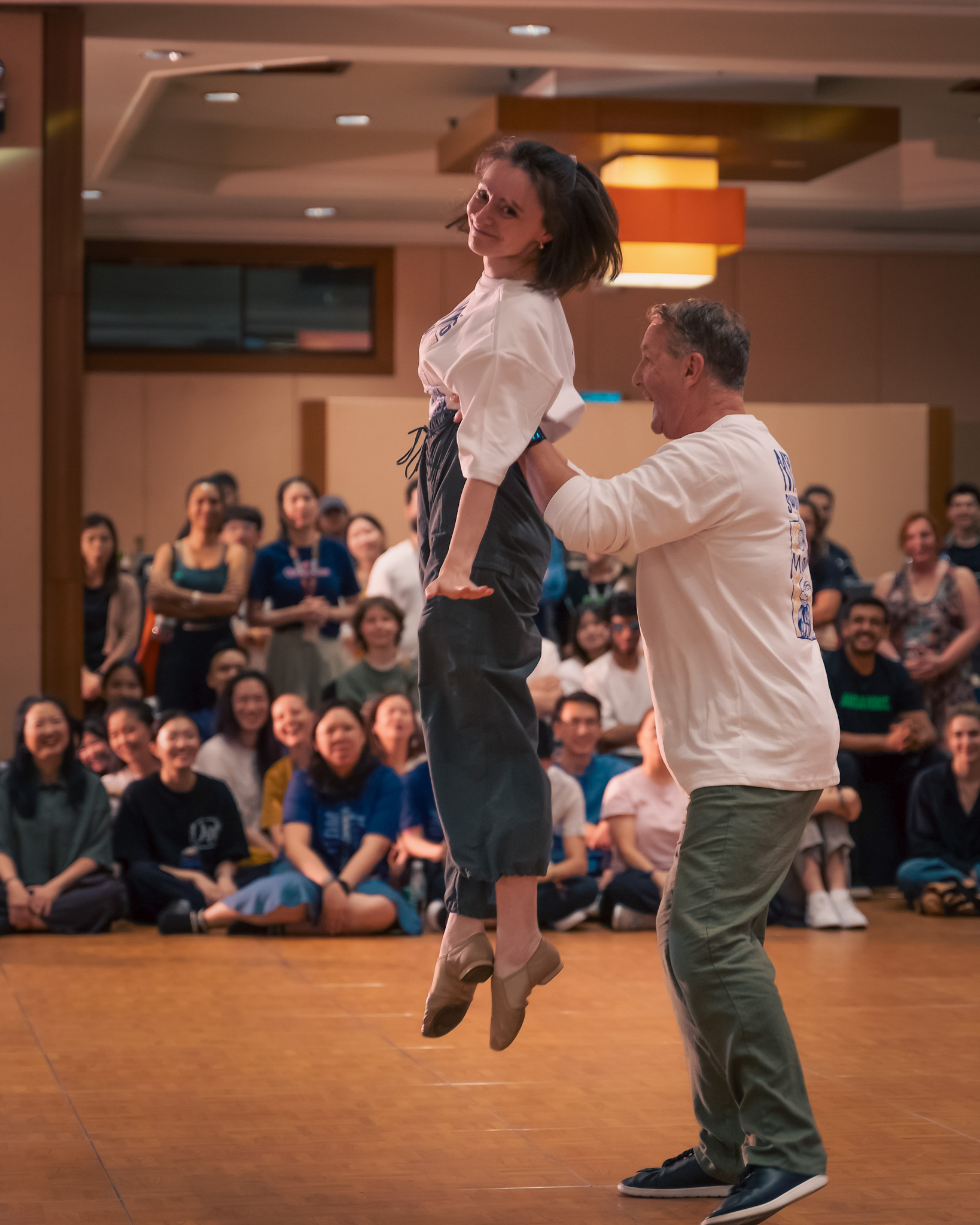 A dancer is lifted high during a Pro Invitational performance.