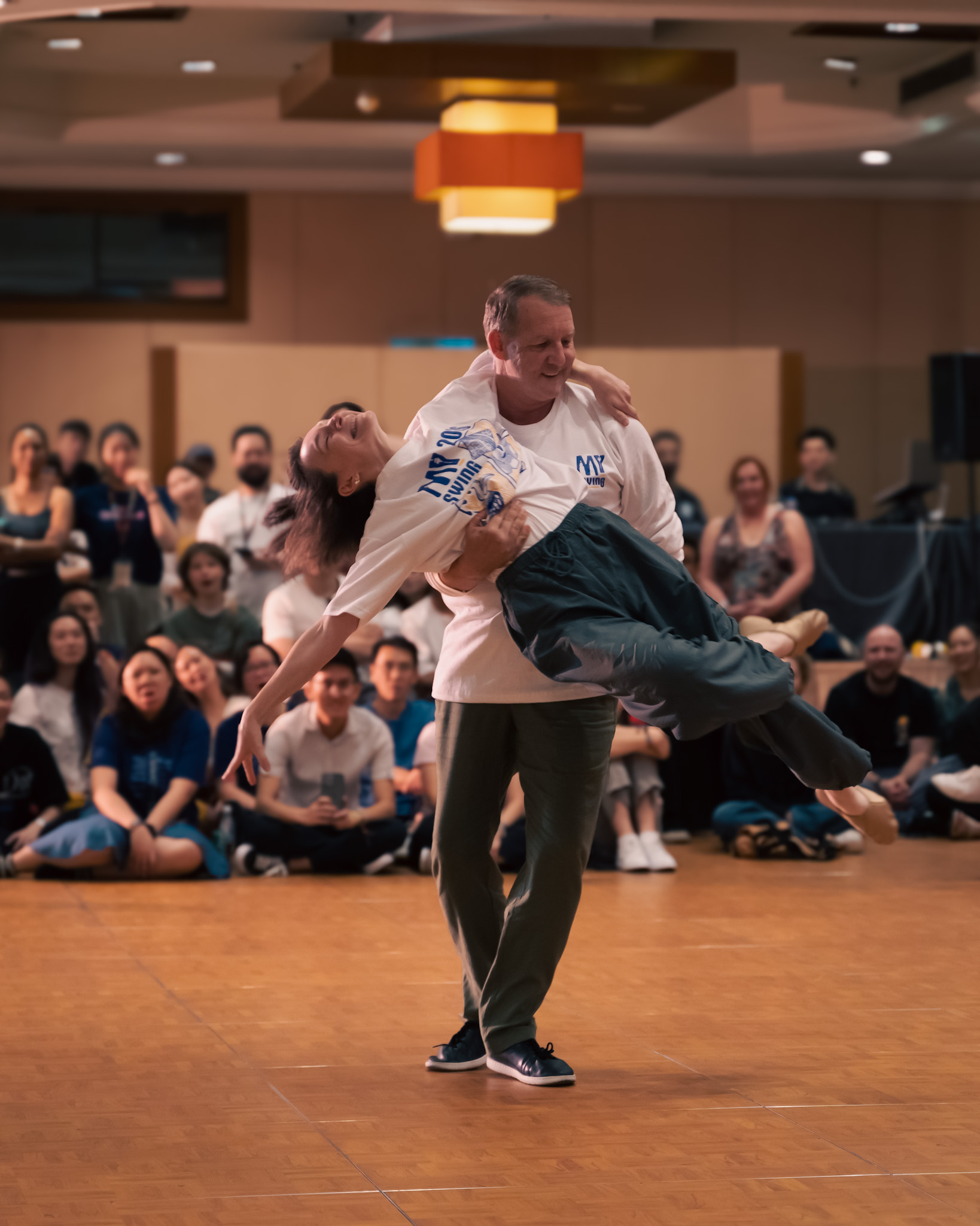 A Pro Invitational pair performs a supported lift.